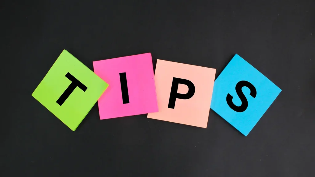 Colorful sticky notes spelling out the word "TIPS" on a black background.