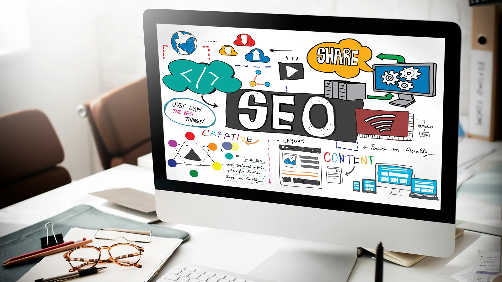 Computer screen displaying a colorful SEO strategy diagram including keywords like content, layout, creative, sharing, and process planning for digital marketing.
